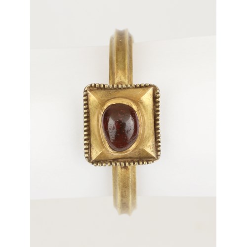 A Fine Medieval Finger-Ring set with a Cabochon Garnet